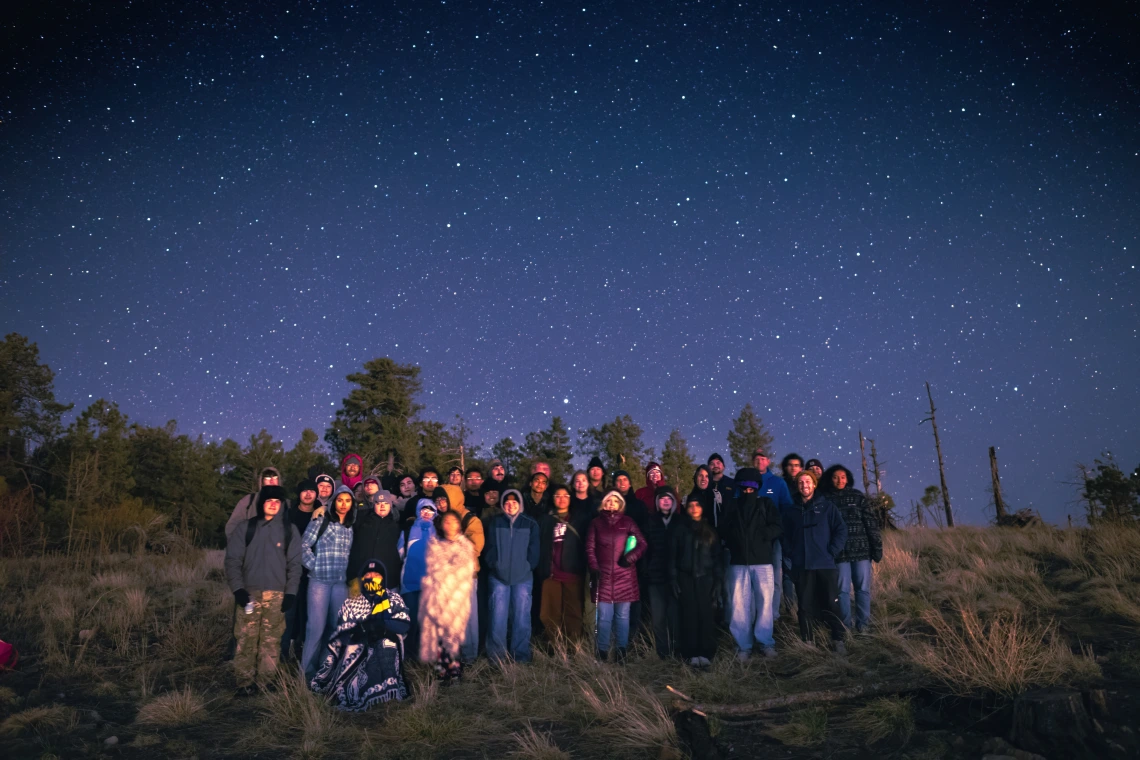 Students under night sky